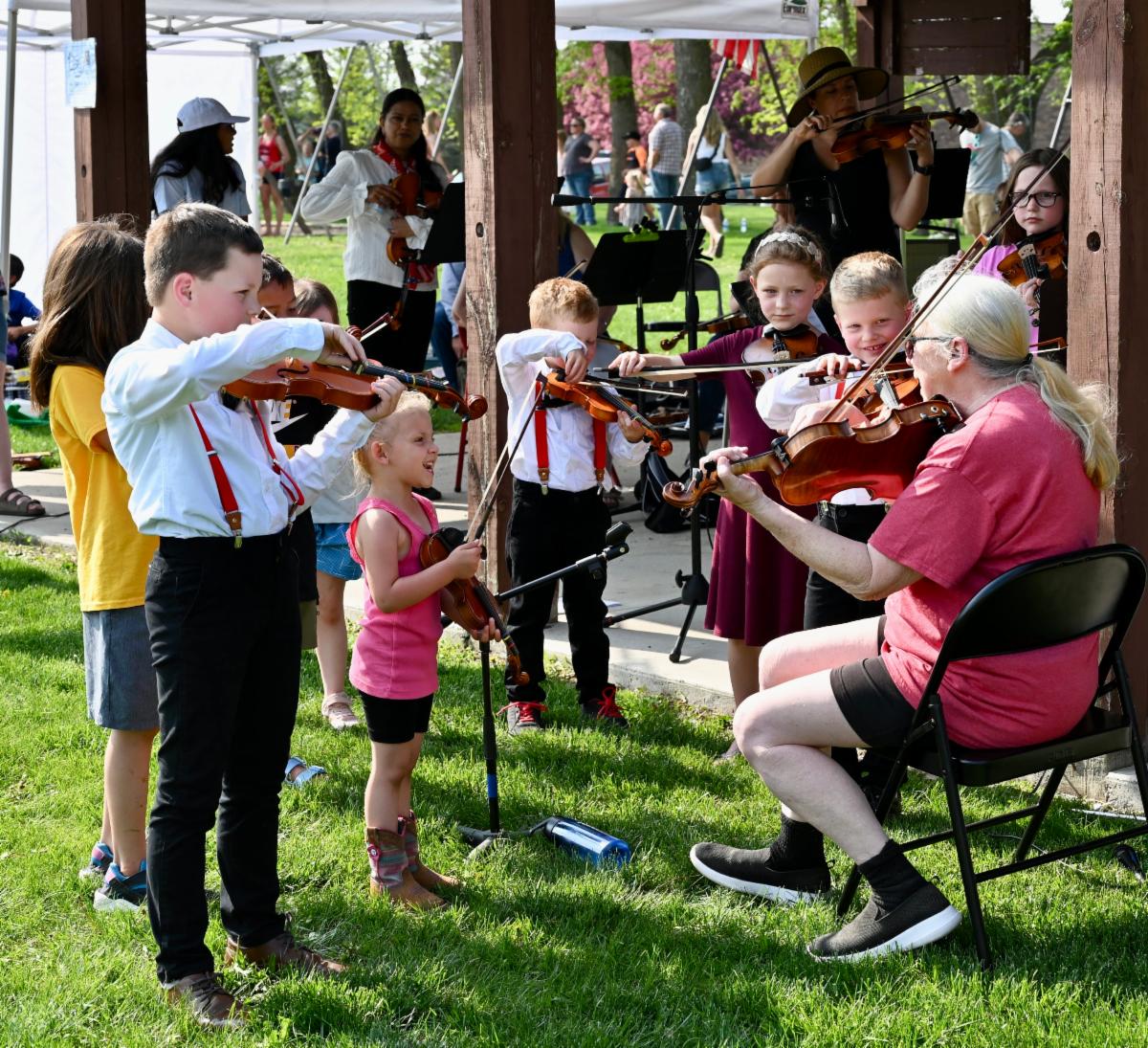 Group of fiddlers outside