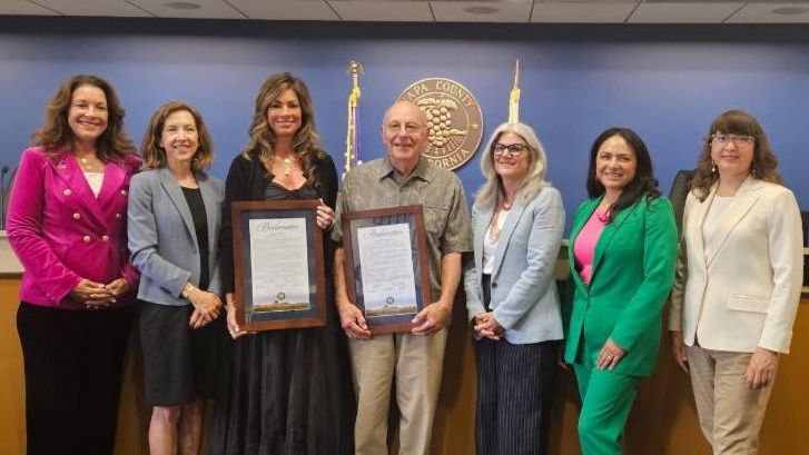 Napa County Board of Supervisors posing with proclamation recipients in the Board Chambers