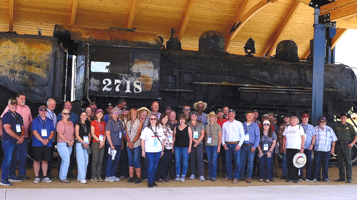 30 County Supervisors from around the state along with RCRC staff posing in front of train.