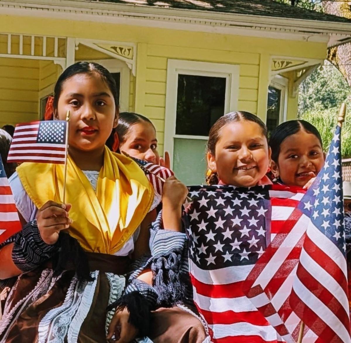 still photo video collage of Calistoga parade participants and onlookers from the sidewalk.