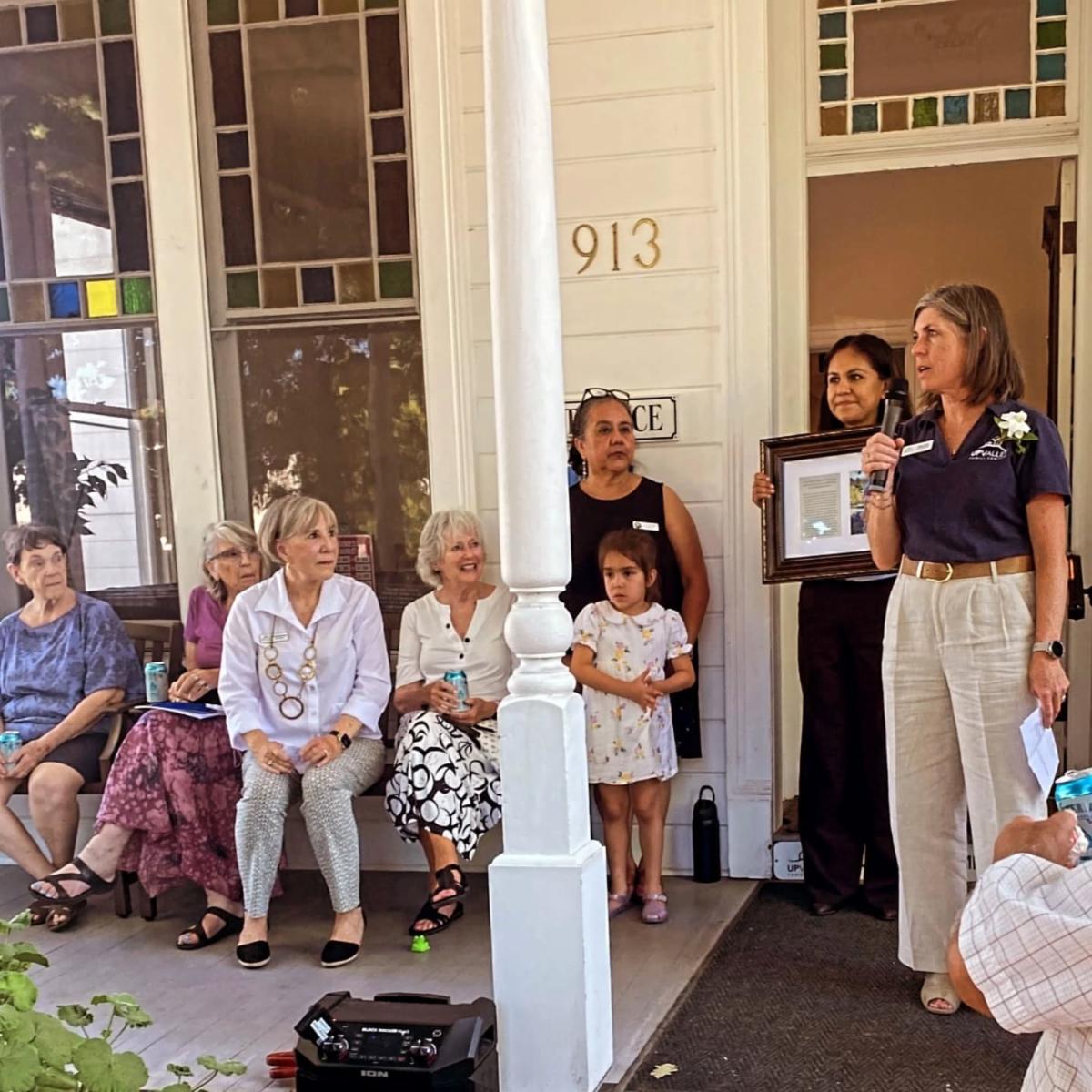 Executive Director Jenny Ocon speaking during the ribbon cutting ceremony