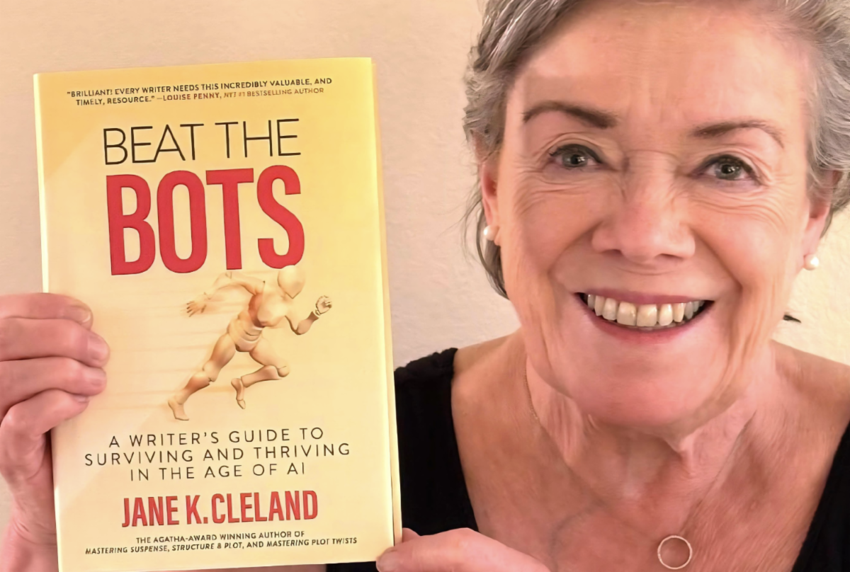 Cleland holds her book