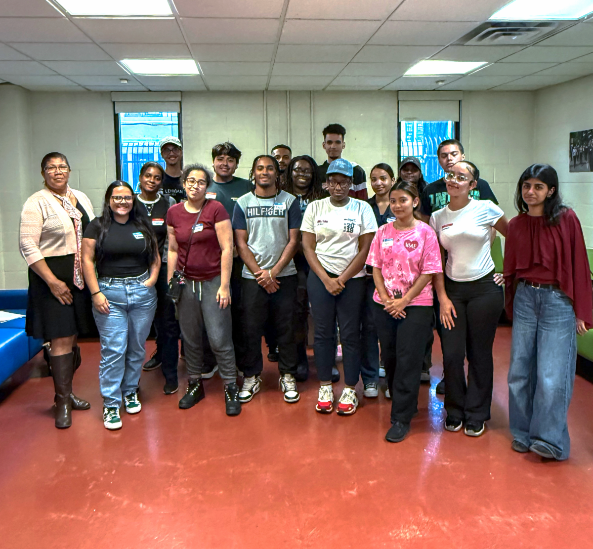 Group posing for a photo in student life building