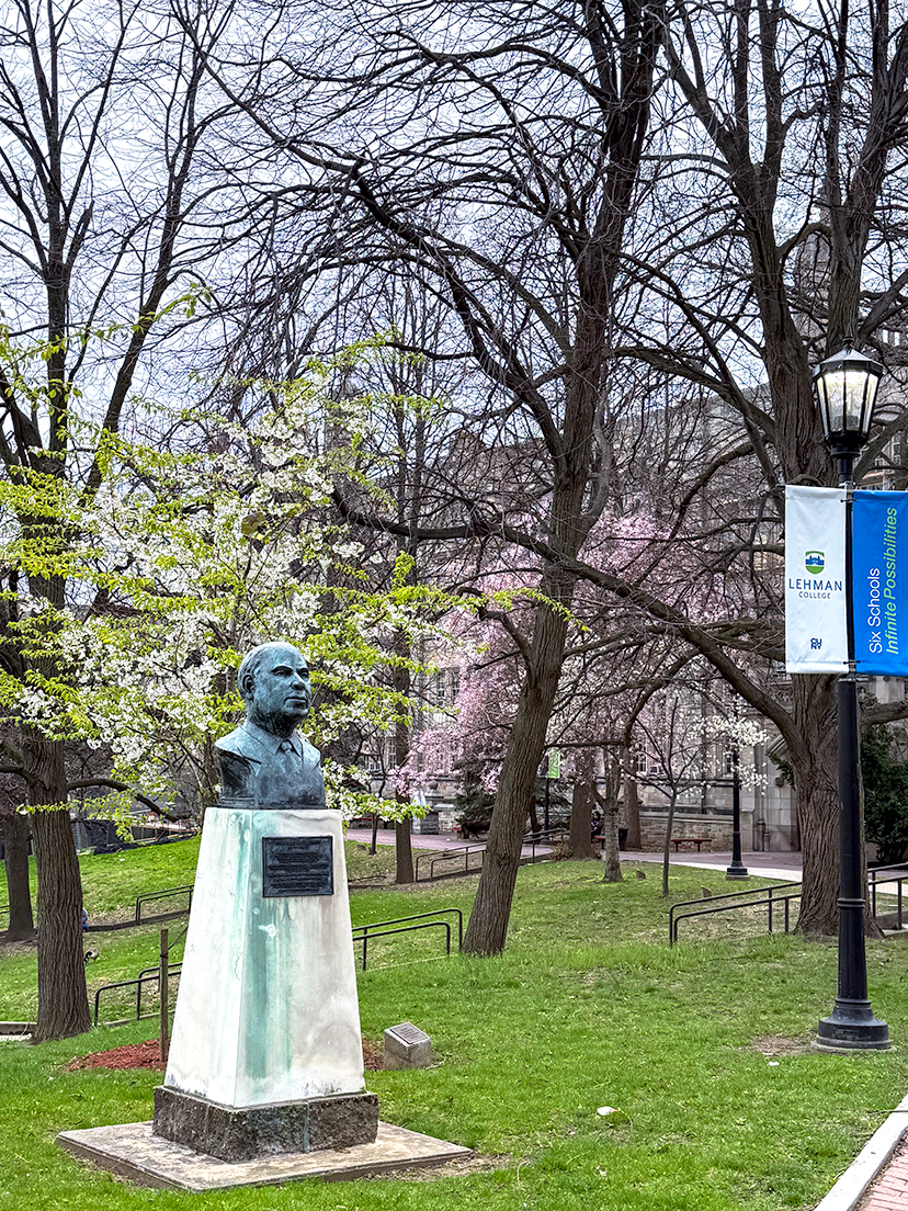 Bust of Herbert Lehman with trees blossoming