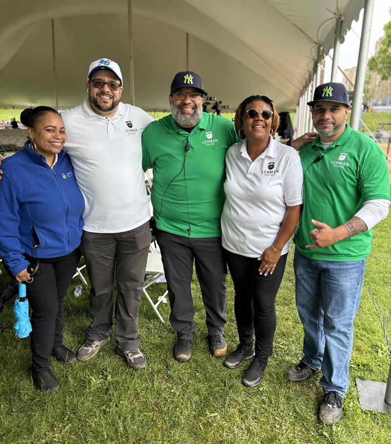 Volunteers in polo shirts with Lehman logos