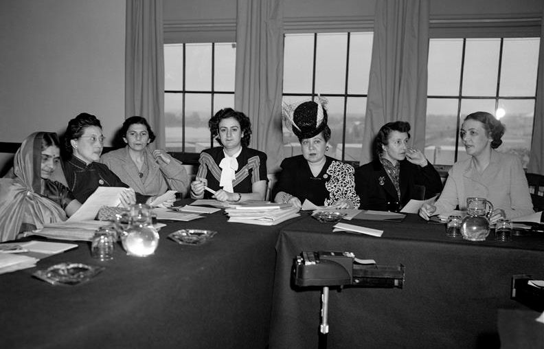 Black and White Archival photo of group of female UN representatives on campus