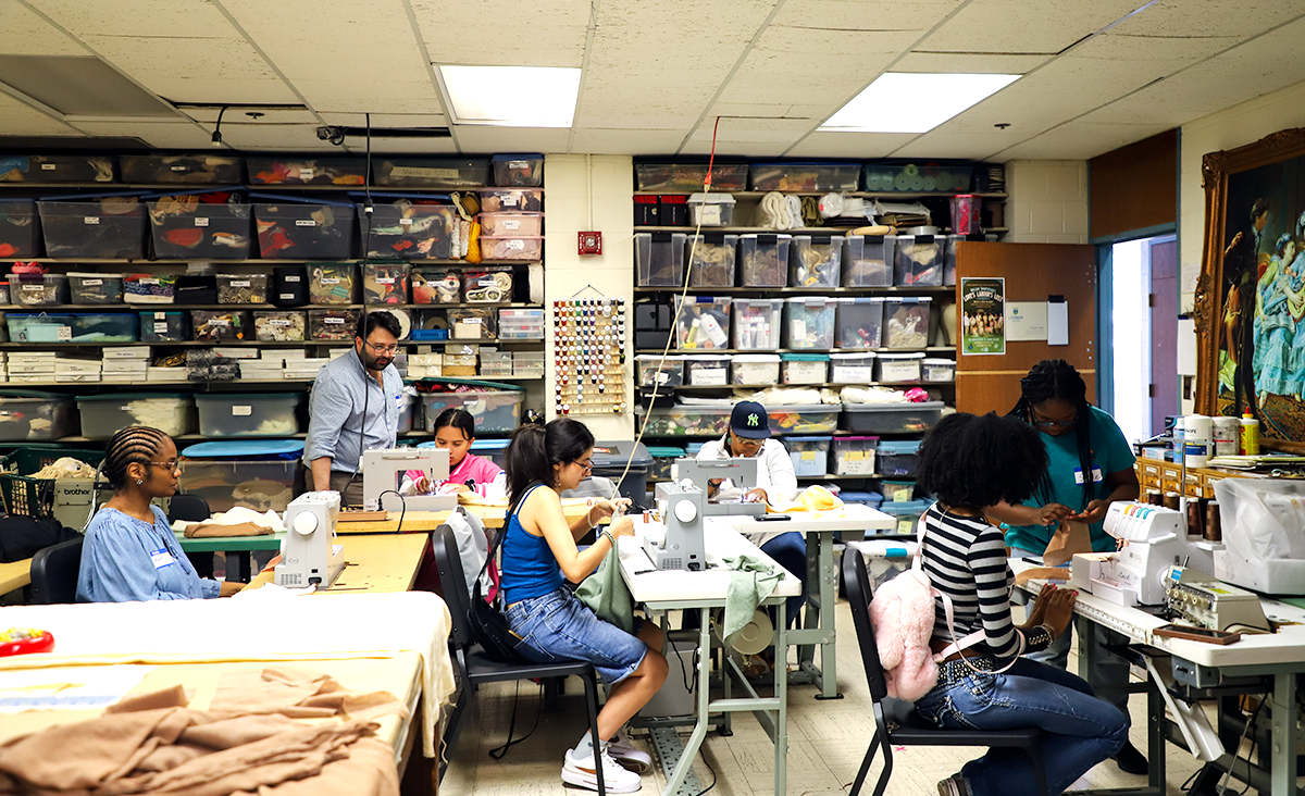 Anthony Paul-Cavarett and participants at costume sewing workshop