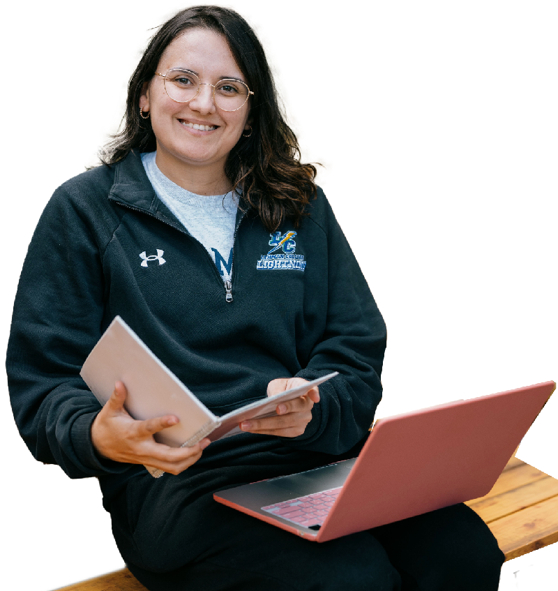 Silhouette of student with laptop and book