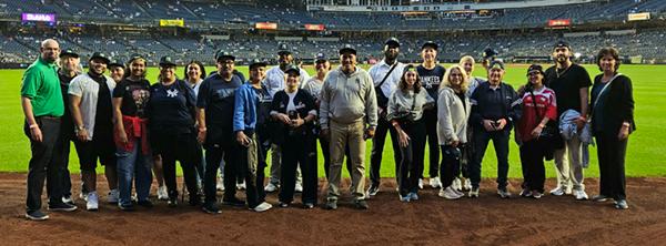 Photo of Lehman's Staff on the field at the Yankee Stadium