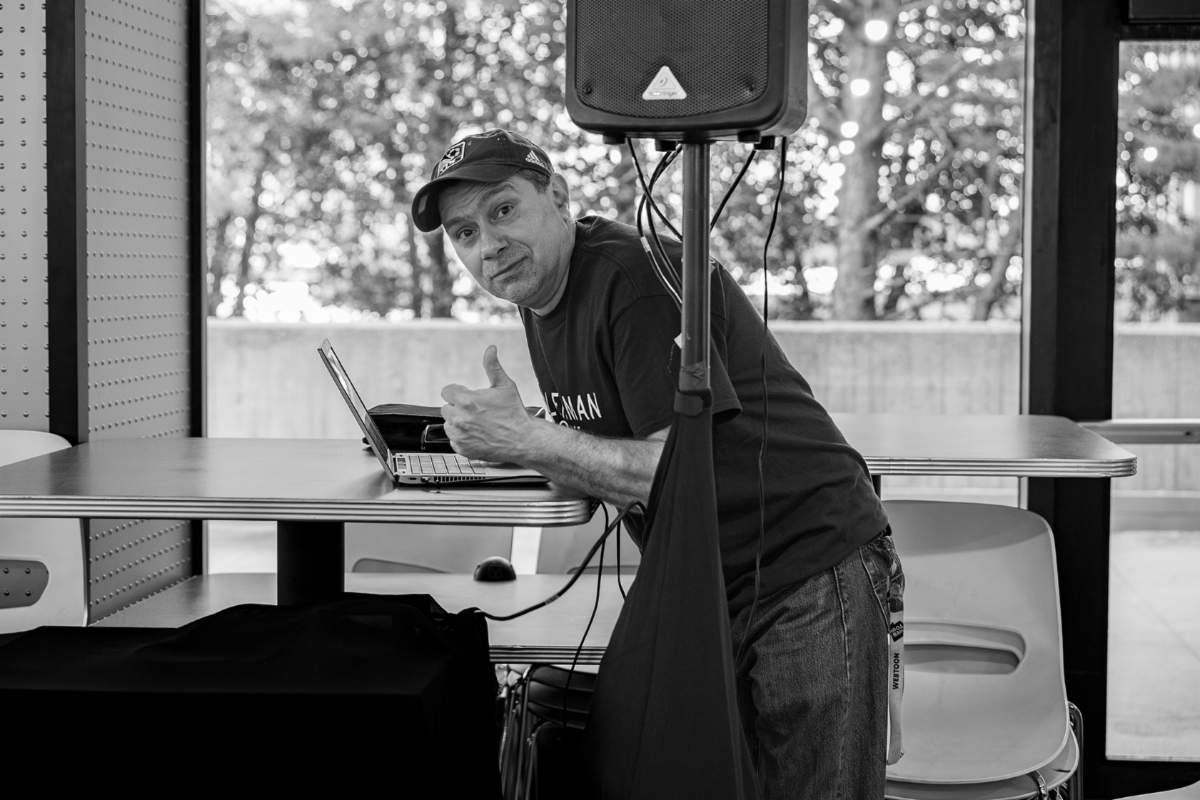 Photo of commencement volunteer on macbook