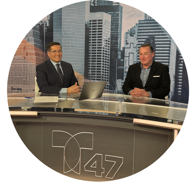 Newscaster and professor at news desk