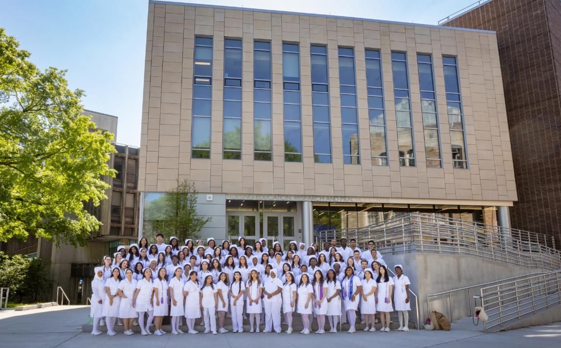 Nurses in front of building in uniform