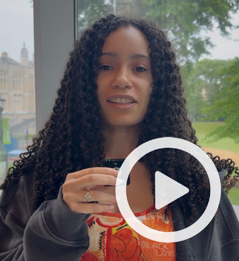 Clickable video still with student holding microphone