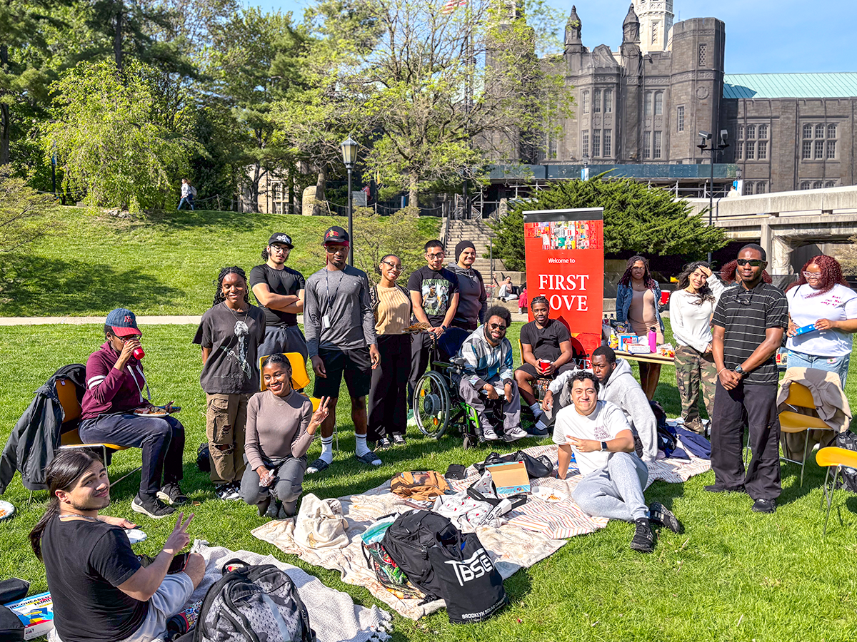Large Group on Quad with Red Club Sign