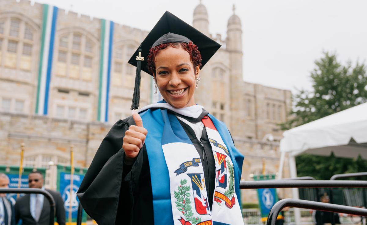 2025 Graduate giving a Thumbs Up