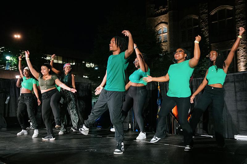 Students Dance Wearing Green Shirts
