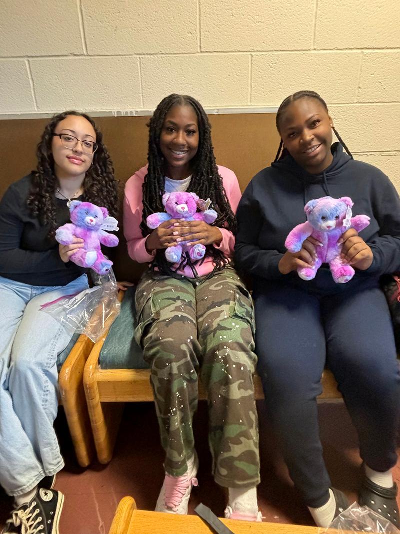 Students with purple bears