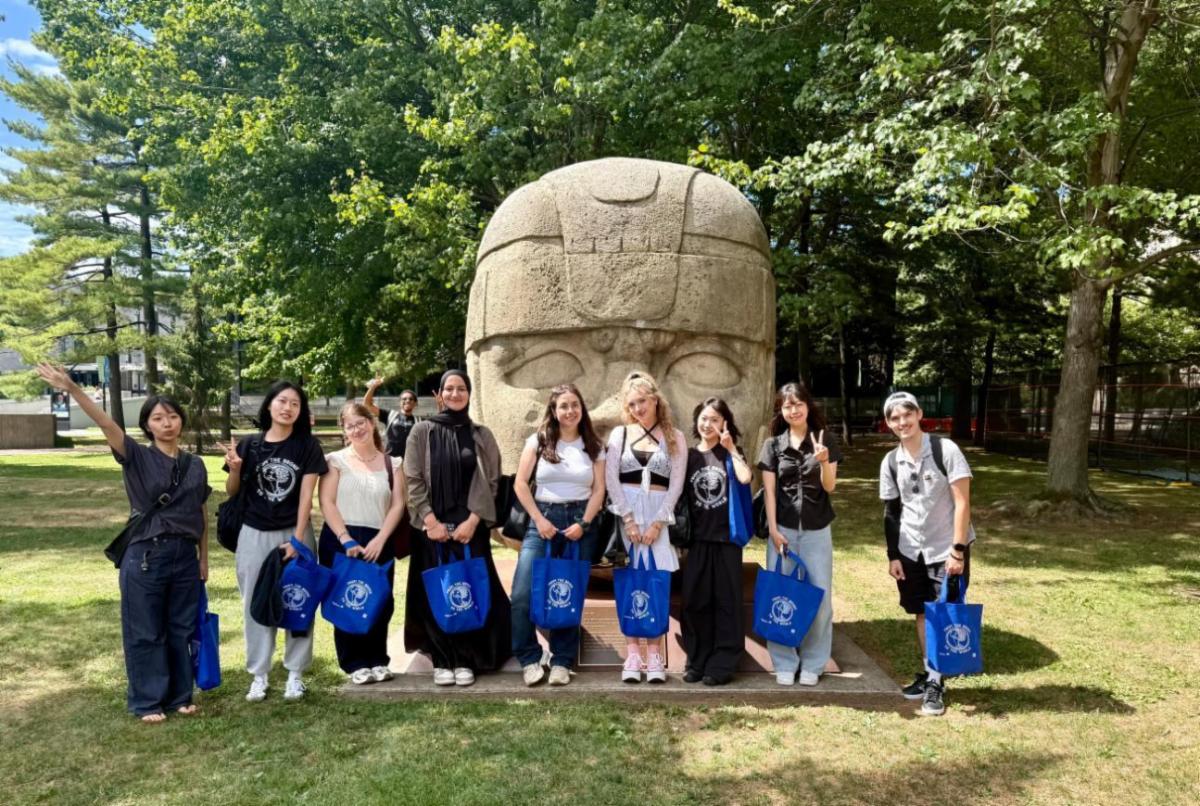 Olmec Head with A Group of international students 