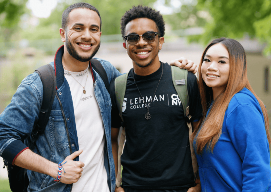 Two male and one female students posing on Lehman's campus