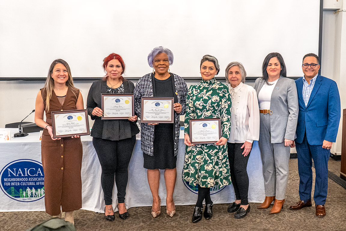 Group photo of panel holding their certificates