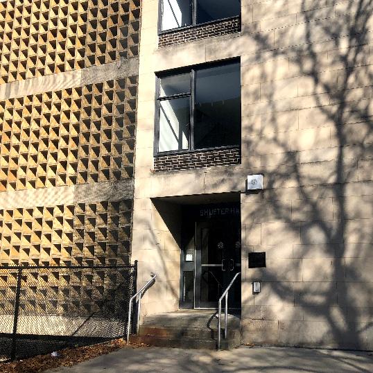 Side of Shuster Hall in decorative circle