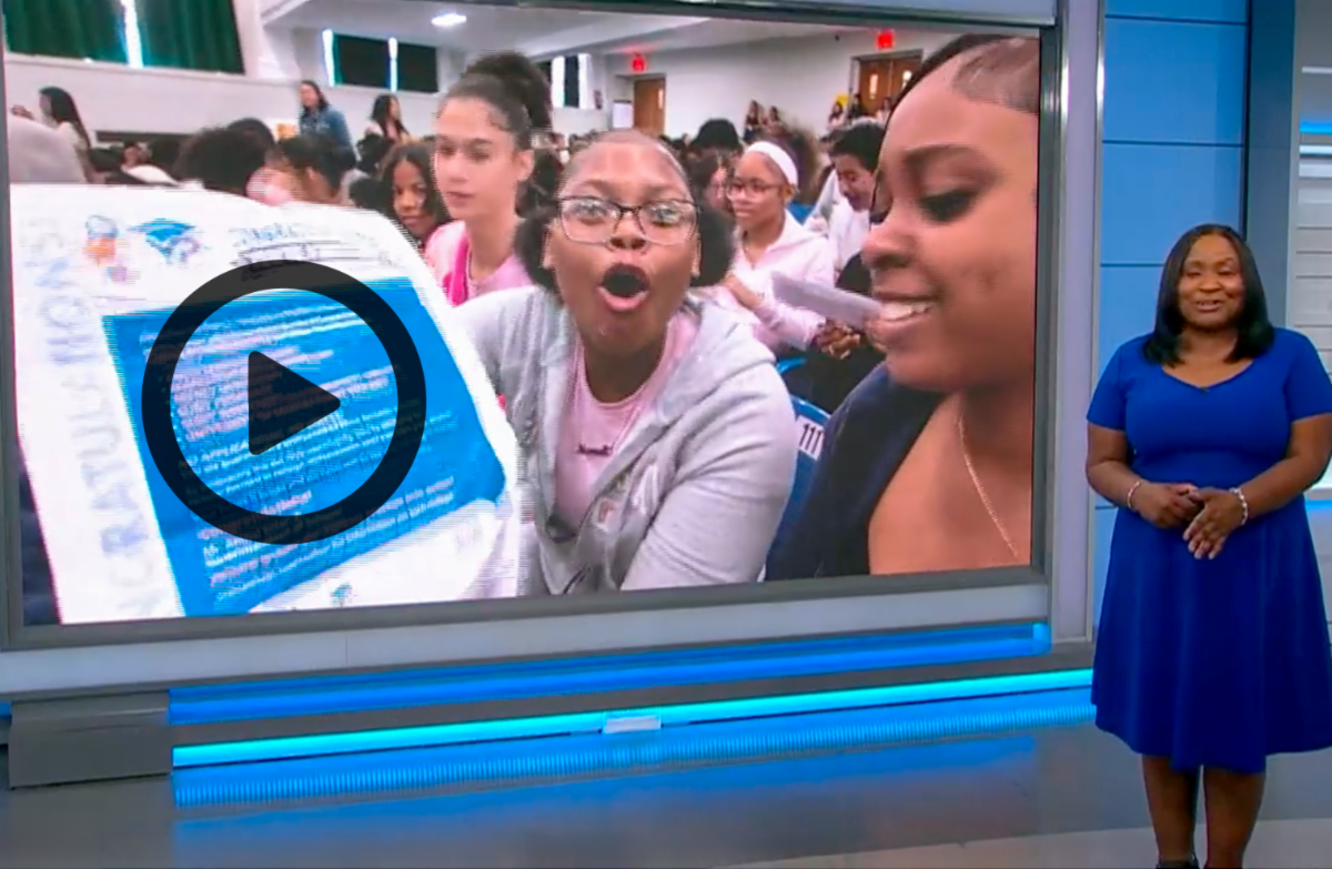 Yonkers student showing excitement upon receiving news of college acceptance.'