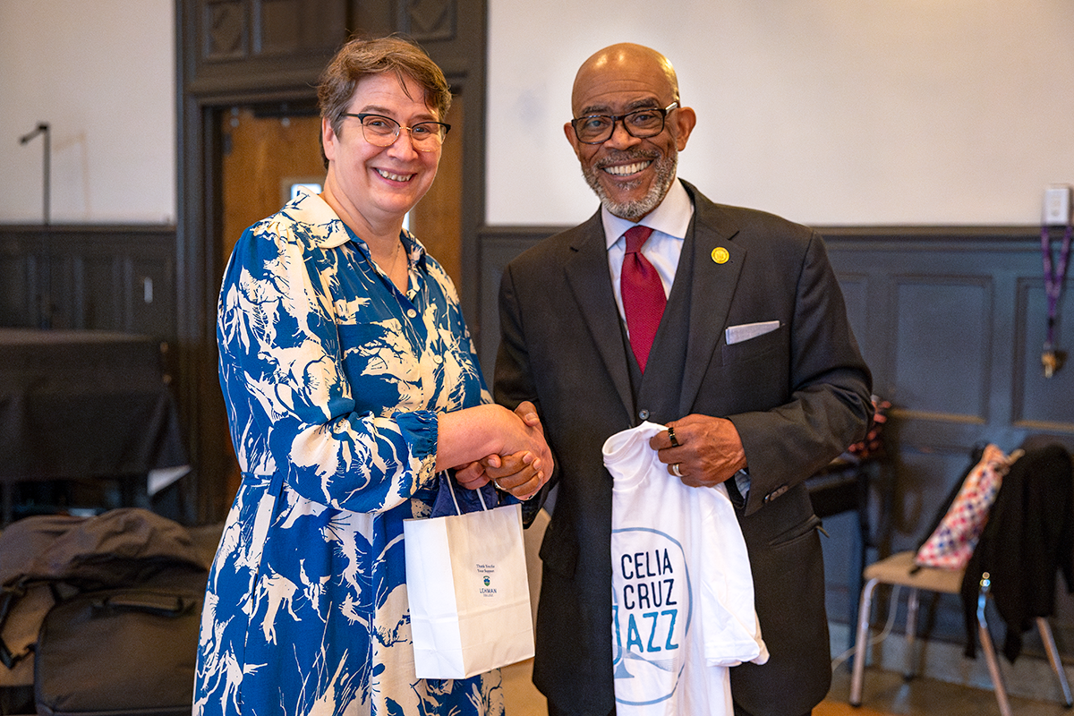 Smiling, posed, handshake photo