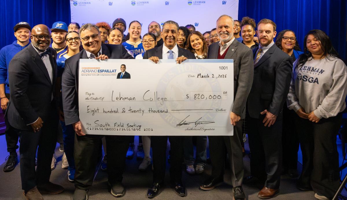 A group including many members of the lehman community with a big check