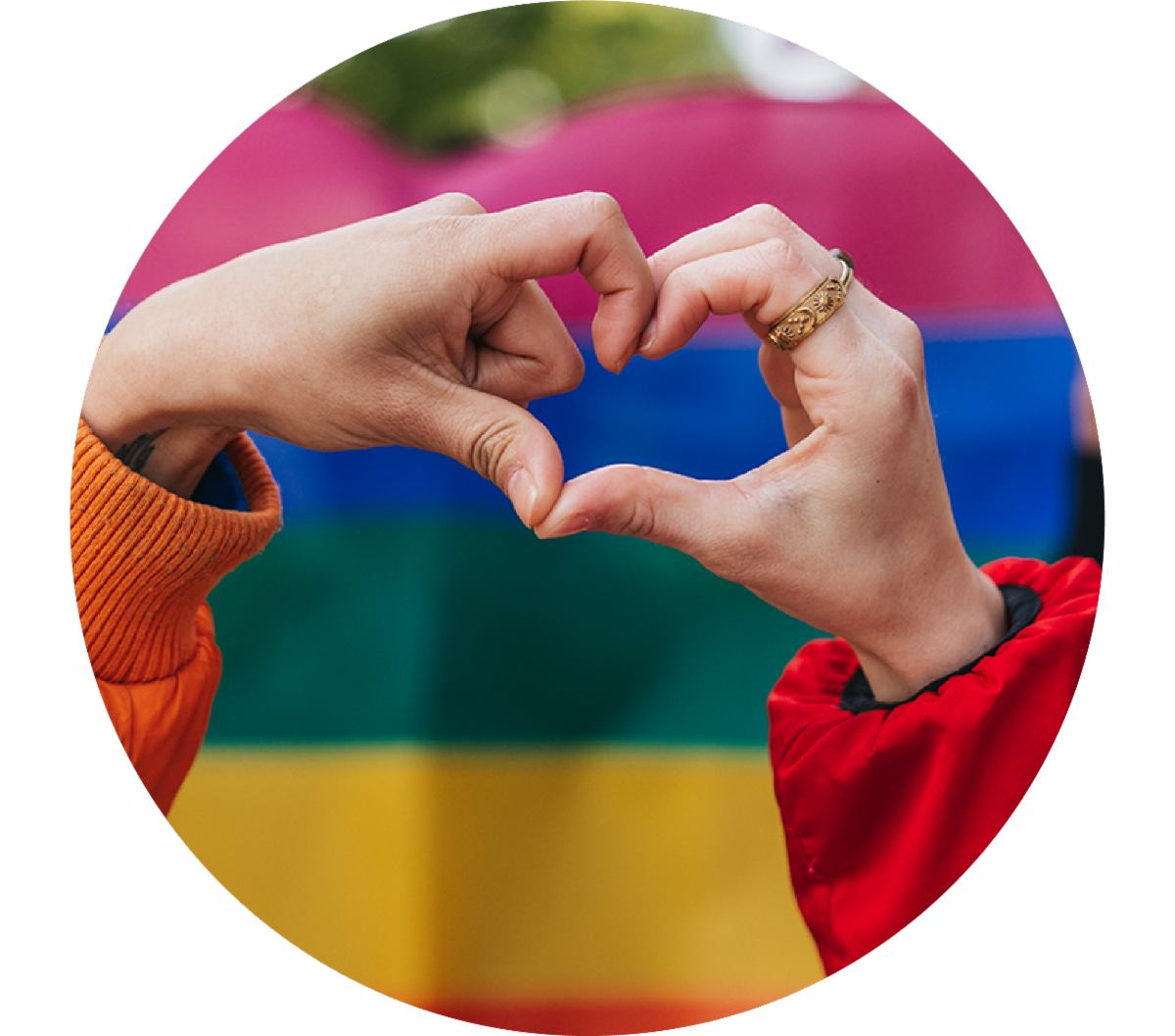 Pride flag and hands in heart shape