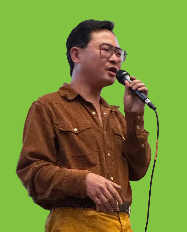 Professor at the microphone silhouetted on green background