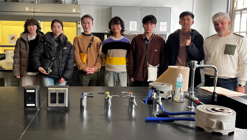 Japanese visiting students in the chem lab with Lehman Professor Jitianu