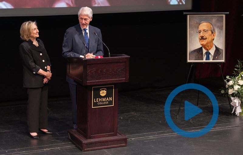 Clickable video still showing the Clintons and a painting of Engel