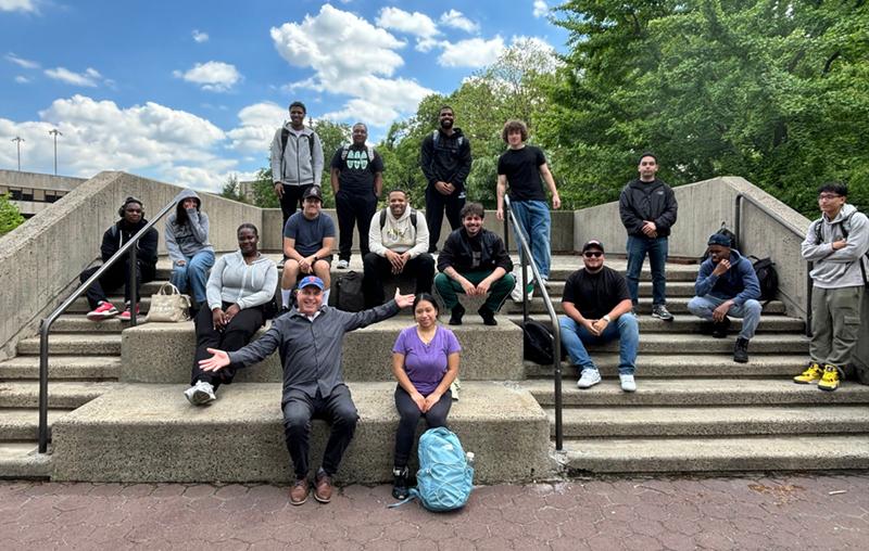 Outdoor photo of Andy and Students
