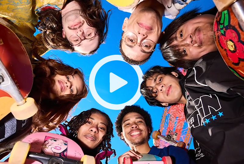 Clickable video still showing skaters with their boards looking down at camera