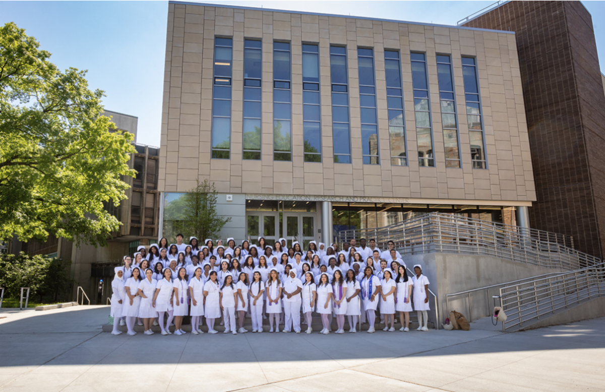 Lehman College nursing students infront of nursing building