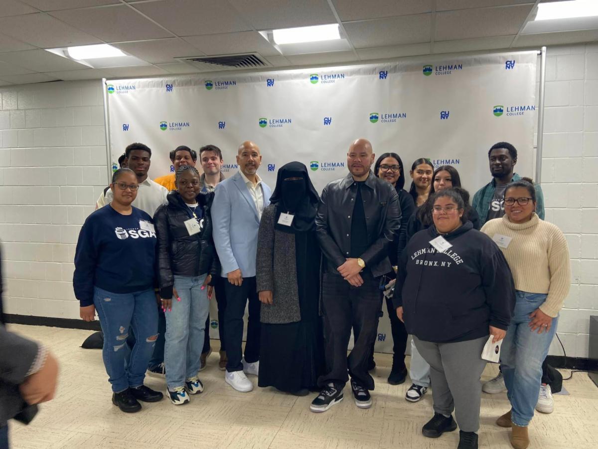Photo of a group of students with the speakers