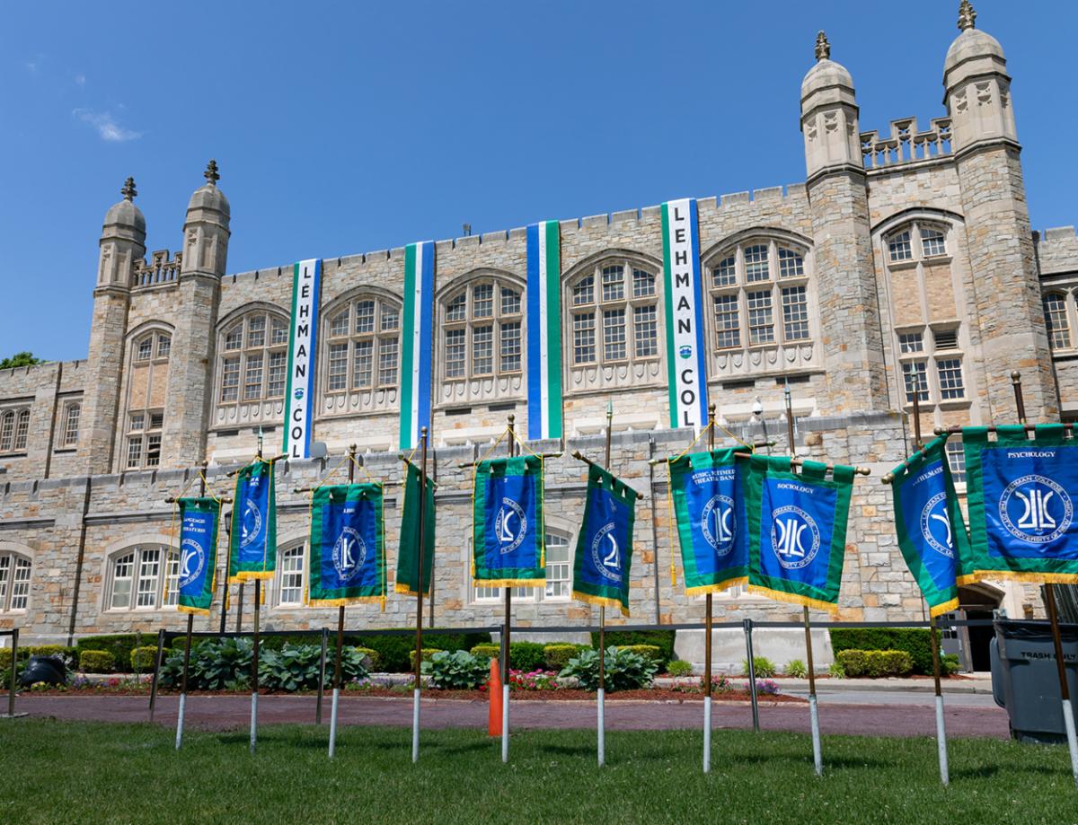 Departmental Flags in front of Old Gym at Commencement