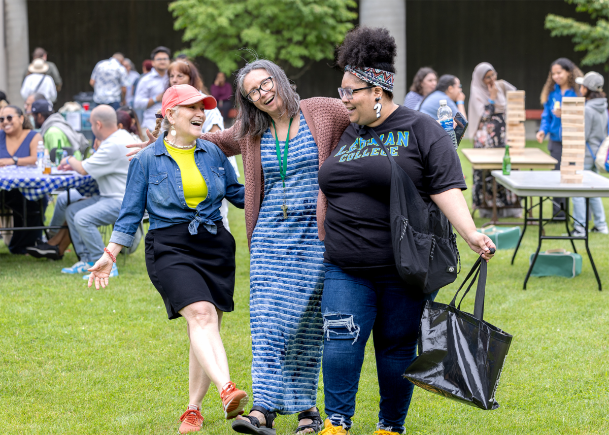 A trio of Lehman employees dance