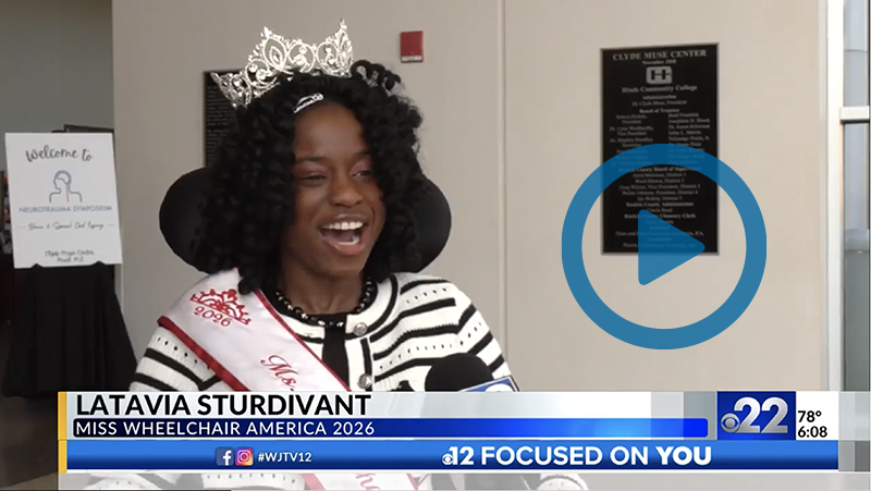 Clickable video still showing Sturdivant with a crown and sash