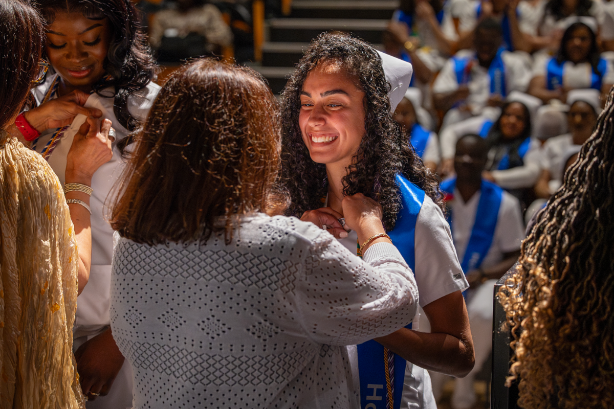 Nursing graduate being pinned