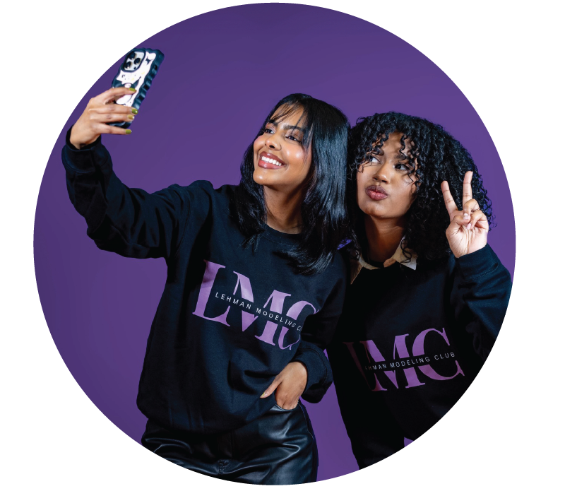 Two Lehman Students in Lehman Modeling Club Sweatshirts