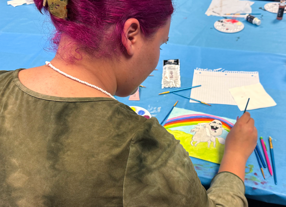 A student paints a rainbow with a unicorn meme
