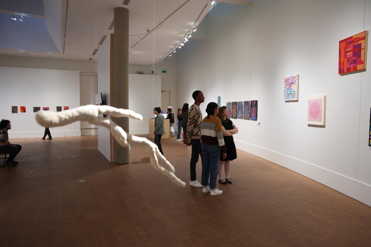 Students attend the BAX 2024 exhibit at the Grinnell College Museum of Art