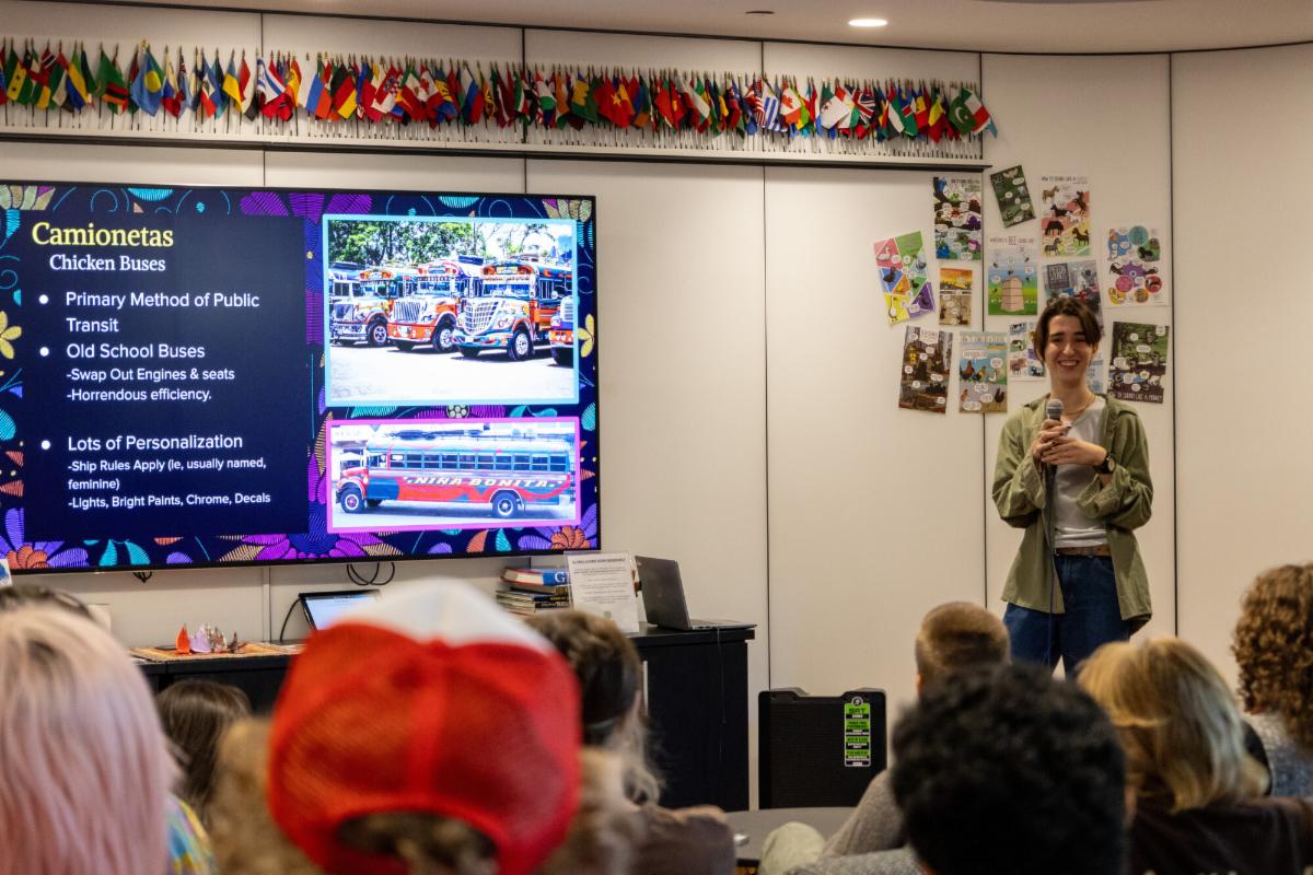 A student presents information about their home country during the Office of International Student Affairs weekly Middle of Everywhere event.
