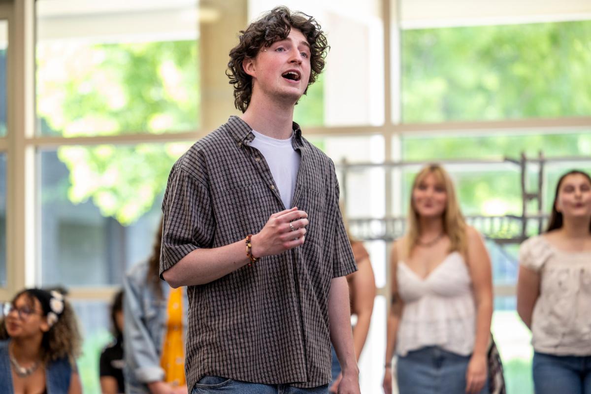 A capella group Con Brio performs in the Bucksbaum Center rotunda May 2025.