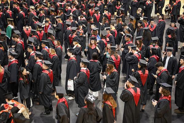 Graduates standing in regala during Commencement ceremony