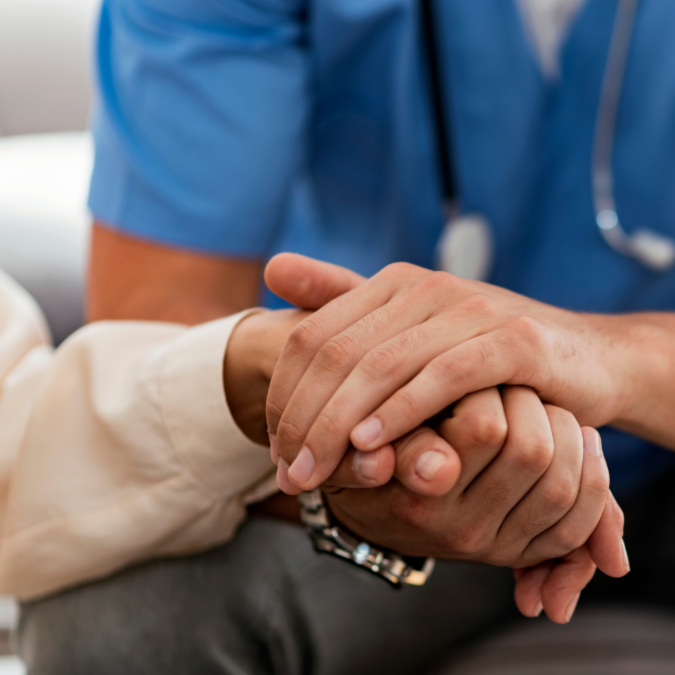 provider holding patient's hand
