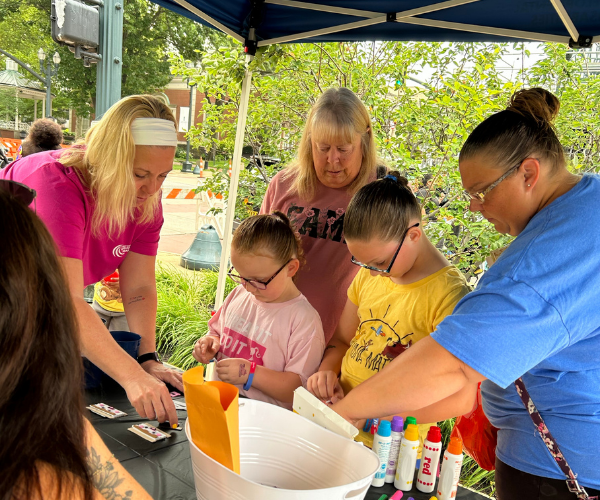 Photo of children making a craft at the Lancaster Day of Action event. 