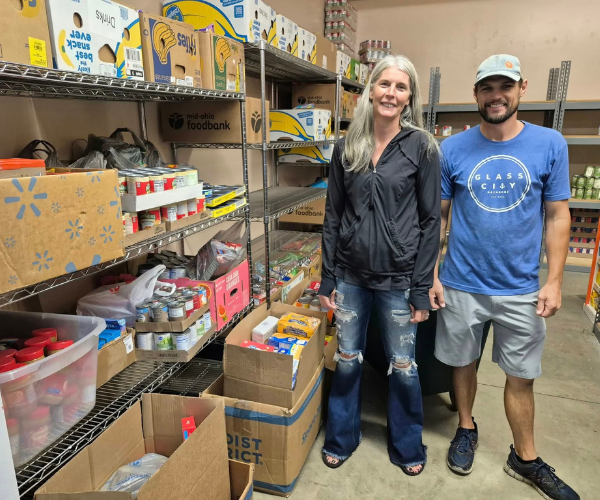 Photo of volunteers at the Lutheran Social Services collecting donated food items.