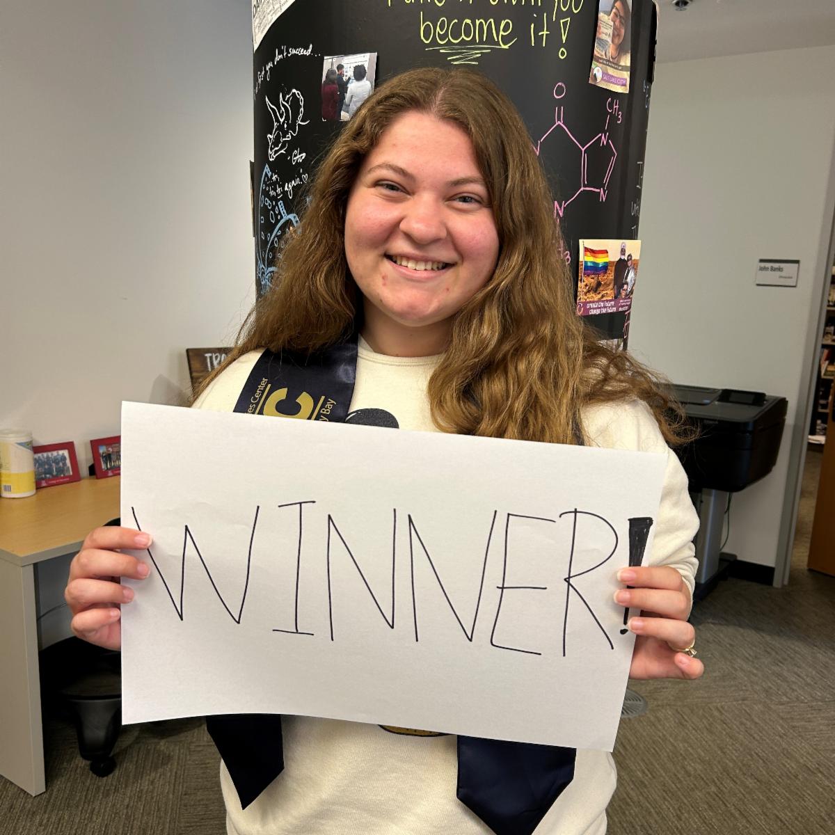 Jenna Slusser holding sign